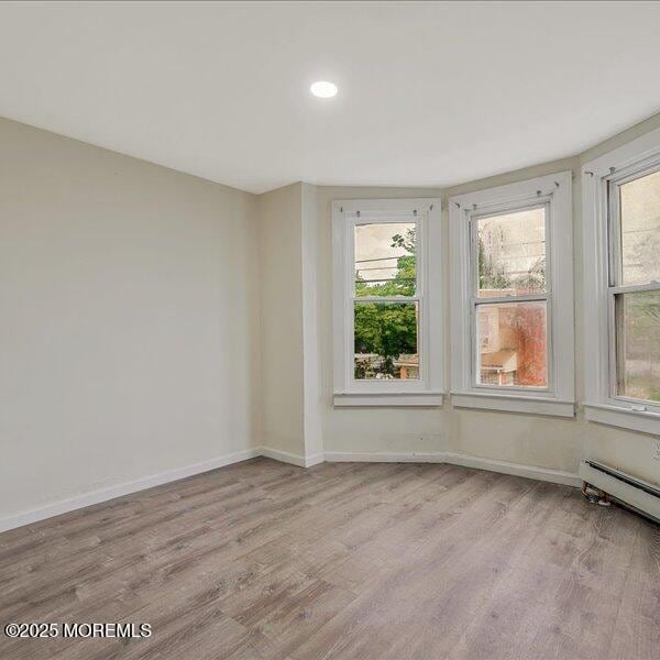 1262 Thurman St, Camden, NJ 08104 - unfurnished room with wood finished floors, baseboards, recessed lighting, and baseboard heating