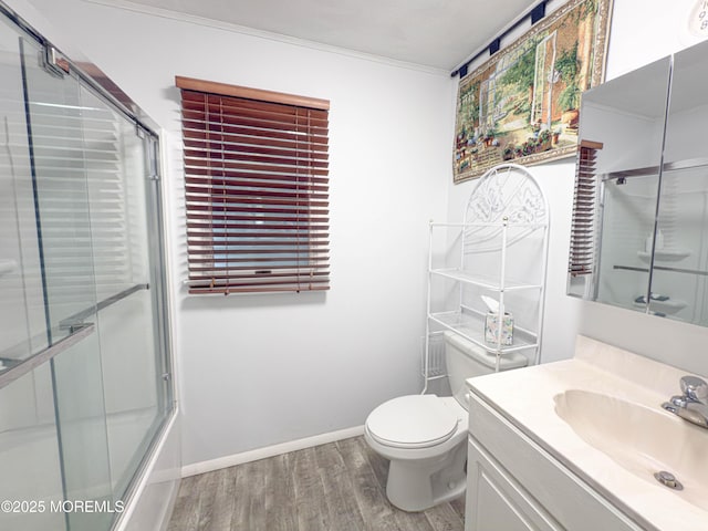 113 Boulder Lake Dr, Little Egg Harbor, NJ 08087 - bathroom featuring wood finished floors, vanity, toilet, baseboards, and crown molding