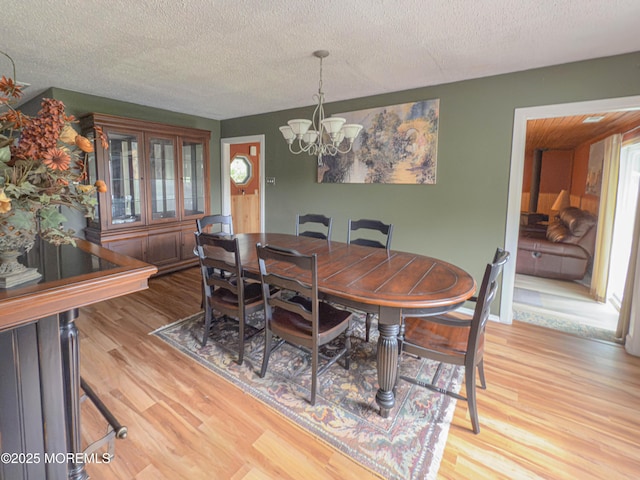 113 Boulder Lake Dr, Little Egg Harbor, NJ 08087 - dining area featuring a chandelier, wood finished floors, and a textured ceiling