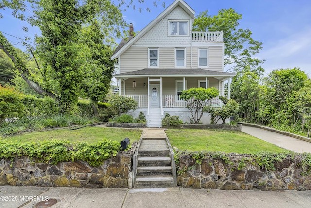 75 Portland Rd, Highlands, NJ 07732 - victorian-style house with covered porch, a front lawn, a chimney, and stairway