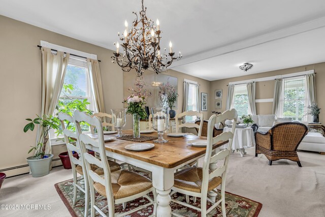 75 Portland Rd, Highlands, NJ 07732 - dining room with a chandelier, plenty of natural light, a baseboard radiator, and light colored carpet