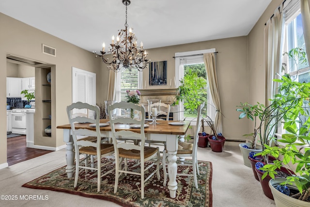 75 Portland Rd, Highlands, NJ 07732 - dining room featuring a chandelier and carpet flooring