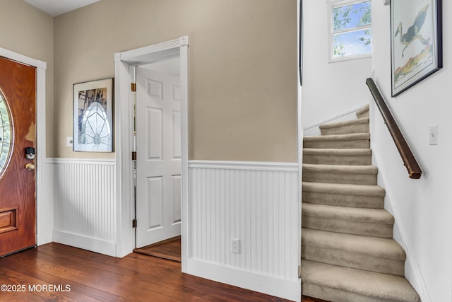 75 Portland Rd, Highlands, NJ 07732 - entryway featuring wainscoting, dark wood-style flooring, and stairs