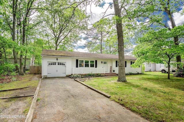629 Alpine St, Forked River, NJ 08731 - single story home with an attached garage, asphalt driveway, and covered porch