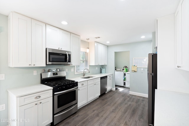 629 Alpine St, Forked River, NJ 08731 - kitchen featuring stainless steel appliances, a sink, washer / clothes dryer, white cabinetry, and recessed lighting