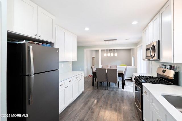 629 Alpine St, Forked River, NJ 08731 - kitchen featuring appliances with stainless steel finishes, light countertops, white cabinetry, dark wood finished floors, and recessed lighting