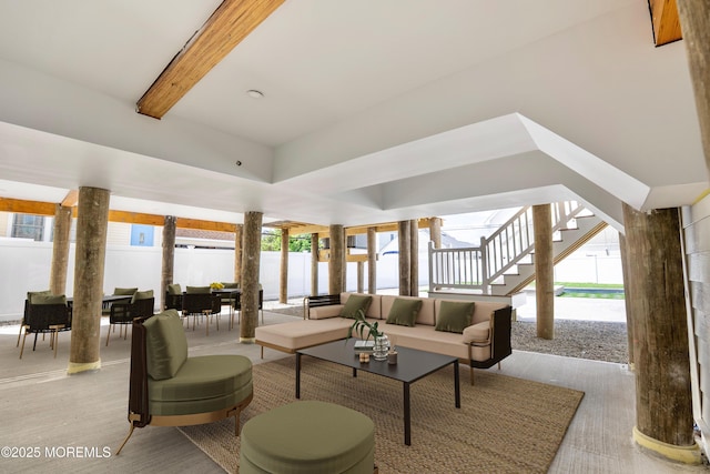 205 Parkway Pt, Pleasant Beach, NJ 08742 - living room featuring beam ceiling, healthy amount of natural light, light wood-type flooring, and stairs