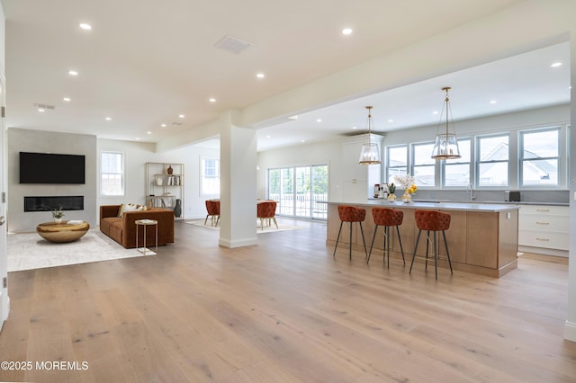 205 Parkway Pt, Pleasant Beach, NJ 08742 - kitchen featuring light wood-style flooring, a spacious island, recessed lighting, and healthy amount of natural light