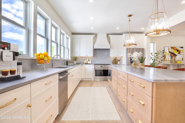 205 Parkway Pt, Pleasant Beach, NJ 08742 - kitchen with custom exhaust hood, stainless steel appliances, a sink, plenty of natural light, and recessed lighting