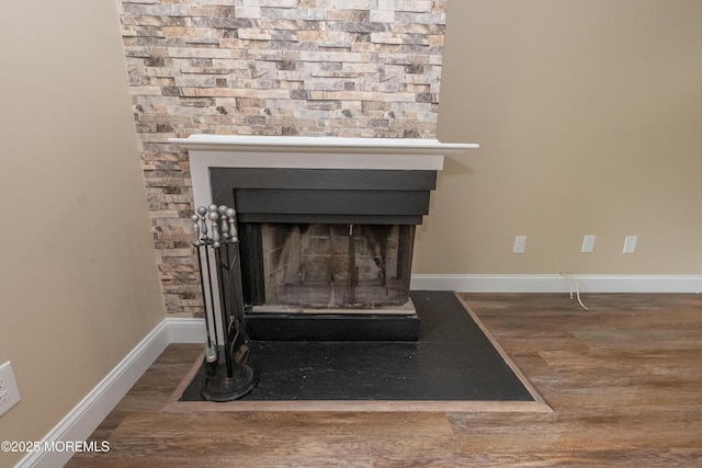 2708 Ridgefield Ct Unit 2708, Helmetta, NJ 08828 - detailed view of wood finished floors, baseboards, and a fireplace with flush hearth