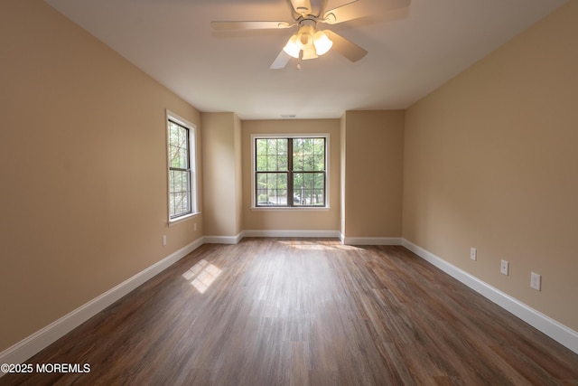 2708 Ridgefield Ct Unit 2708, Helmetta, NJ 08828 - spare room featuring dark wood finished floors, baseboards, and a ceiling fan