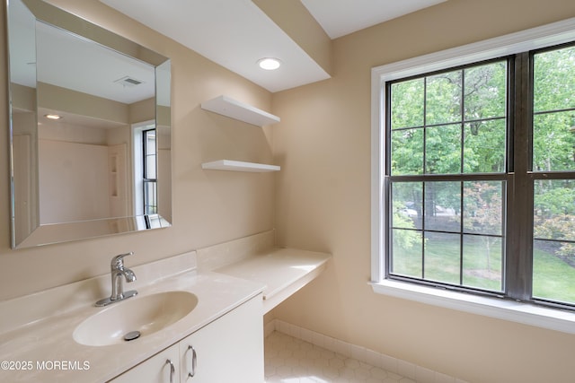 2708 Ridgefield Ct Unit 2708, Helmetta, NJ 08828 - bathroom with healthy amount of natural light, vanity, and tile patterned floors