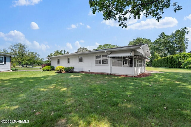 8 Holmes Ct, Brick, NJ 08724 - back of property with a sunroom and a yard
