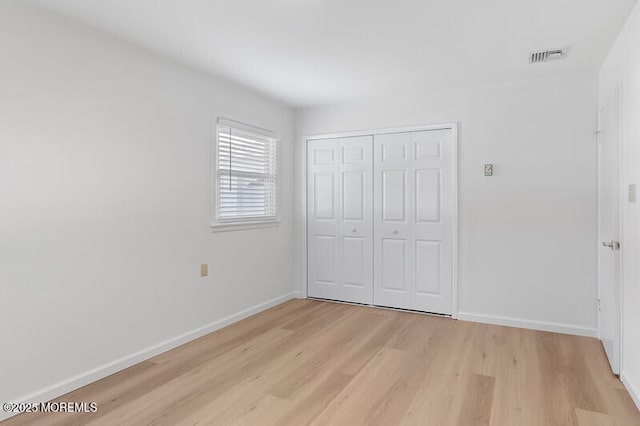 8 Holmes Ct, Brick, NJ 08724 - unfurnished bedroom with light wood-type flooring and a closet