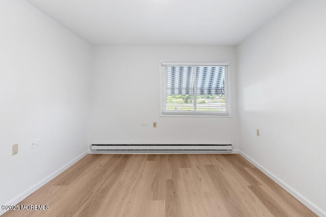 8 Holmes Ct, Brick, NJ 08724 - unfurnished room featuring a baseboard radiator and light wood-type flooring