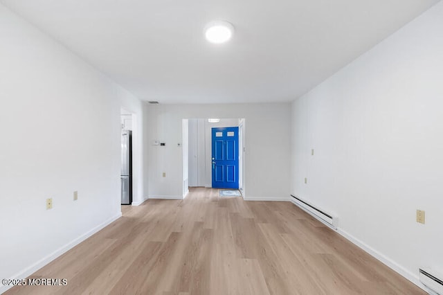 8 Holmes Ct, Brick, NJ 08724 - spare room featuring baseboard heating and light wood-type flooring
