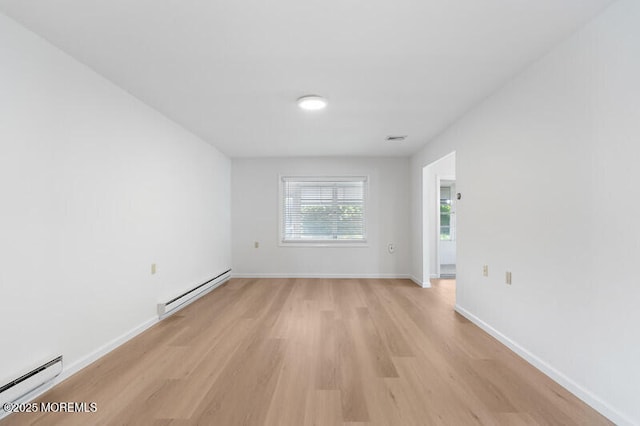 8 Holmes Ct, Brick, NJ 08724 - unfurnished room featuring baseboard heating and light wood finished floors