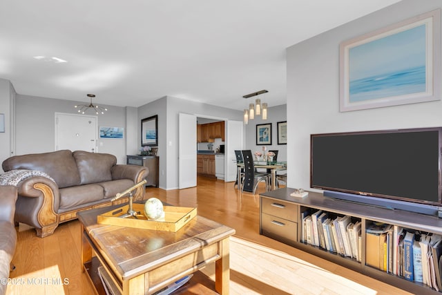 1 Scenic Dr Unit 511, Highlands, NJ 07732 - living area featuring a chandelier and light wood finished floors