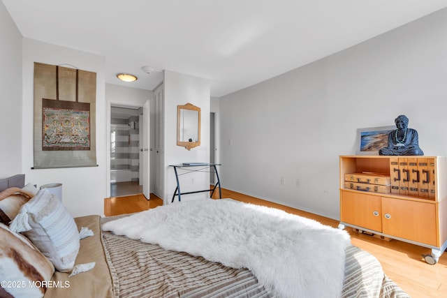 1 Scenic Dr Unit 511, Highlands, NJ 07732 - bedroom featuring light wood-style floors and ensuite bathroom