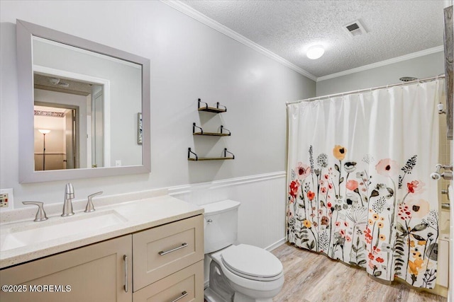 5-3 Portland Ct, Freehold, NJ 07728 - bathroom featuring toilet, vanity, wood finished floors, a textured ceiling, and ornamental molding