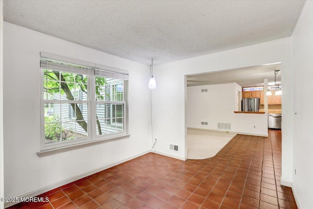 5-3 Portland Ct, Freehold, NJ 07728 - spare room with a textured ceiling, dark tile patterned flooring, a chandelier, and baseboards