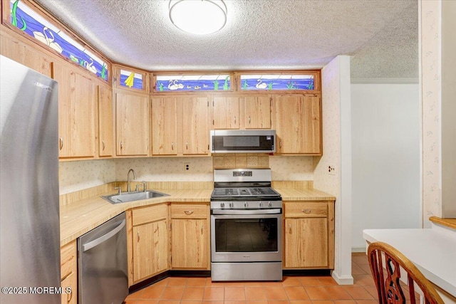 5-3 Portland Ct, Freehold, NJ 07728 - kitchen with stainless steel appliances, a sink, light countertops, light tile patterned floors, and a textured ceiling