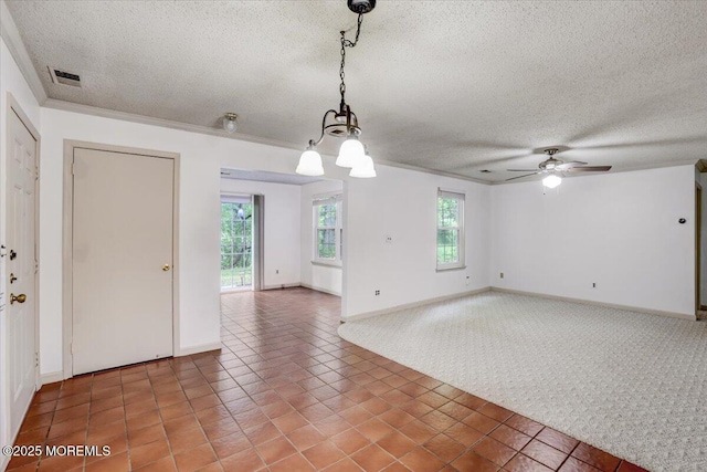 5-3 Portland Ct, Freehold, NJ 07728 - spare room featuring a textured ceiling, light colored carpet, healthy amount of natural light, a ceiling fan, and light tile patterned floors