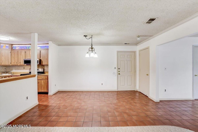5-3 Portland Ct, Freehold, NJ 07728 - kitchen with tile patterned floors, baseboards, a textured ceiling, decorative light fixtures, and light countertops