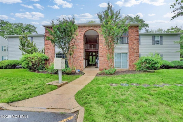 5-3 Portland Ct, Freehold, NJ 07728 - view of front of house with a front yard and brick siding