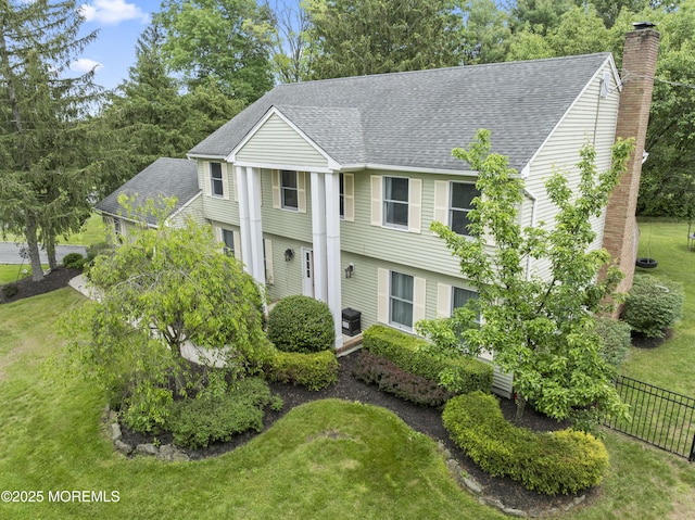 2 Apple Grove Dr, Holmdel, NJ 07733 - view of front facade with roof with shingles and a chimney