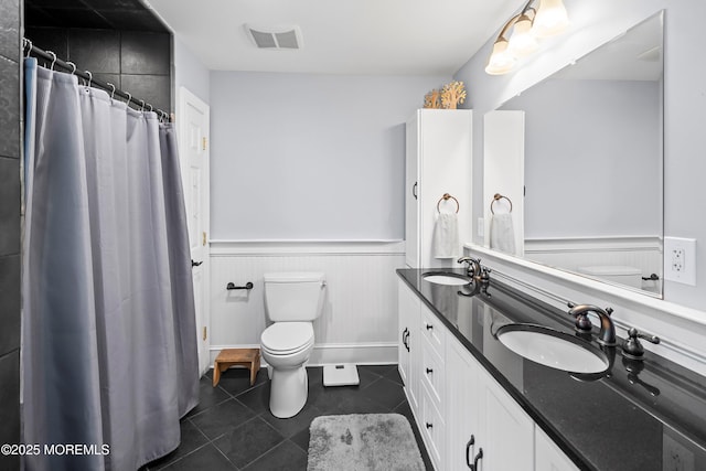 660 Summit Ave, Kenilworth, NJ 07033 - full bath with toilet, tile patterned floors, a wainscoted wall, double vanity, and curtained shower