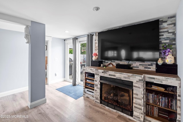 660 Summit Ave, Kenilworth, NJ 07033 - living area featuring wood finished floors, baseboards, and a stone fireplace