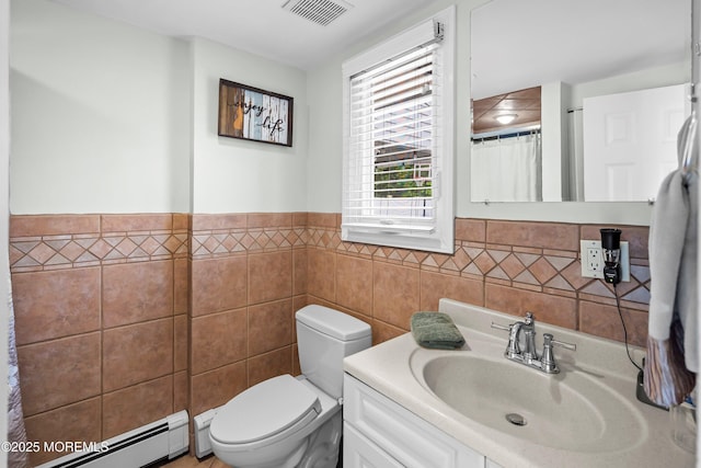 660 Summit Ave, Kenilworth, NJ 07033 - bathroom with a baseboard heating unit, tile walls, toilet, vanity, and a wainscoted wall
