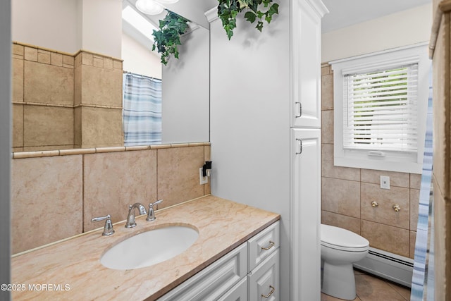660 Summit Ave, Kenilworth, NJ 07033 - full bathroom with a baseboard radiator, tile walls, vanity, toilet, and tile patterned floors