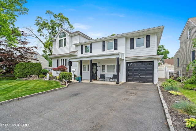 660 Summit Ave, Kenilworth, NJ 07033 - view of front of home with covered porch, driveway, and a garage