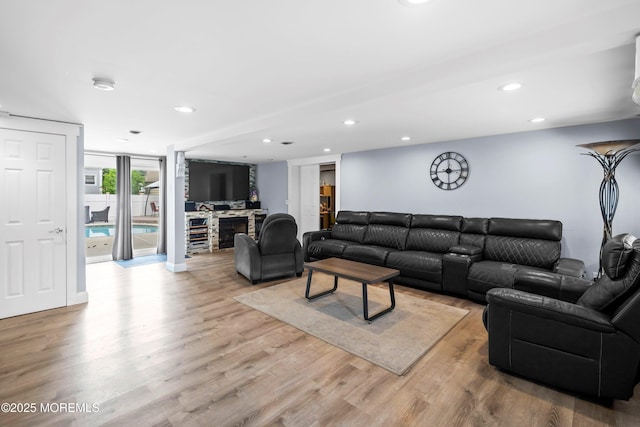 660 Summit Ave, Kenilworth, NJ 07033 - living area with wood finished floors, recessed lighting, and a fireplace