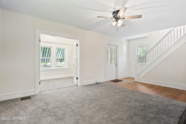 23 Stokes St, Freehold, NJ 07728 - foyer with ceiling fan, stairway, baseboards, and carpet floors