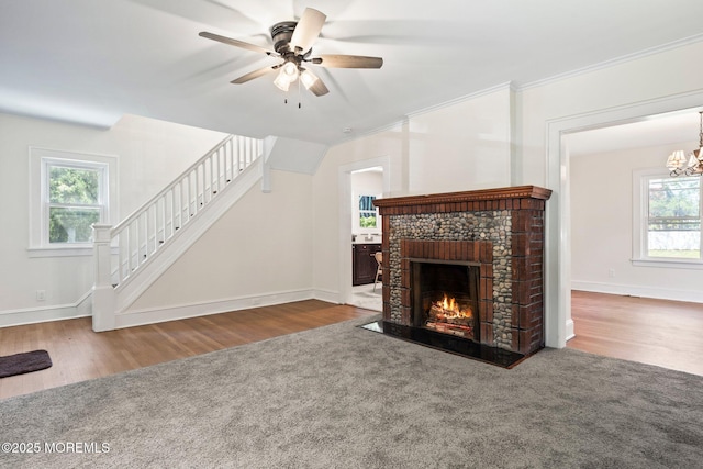 23 Stokes St, Freehold, NJ 07728 - unfurnished living room with ceiling fan, stairway, wood finished floors, and a chandelier