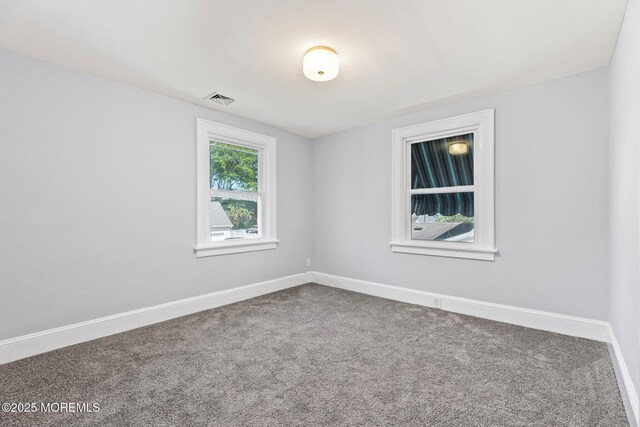 23 Stokes St, Freehold, NJ 07728 - spare room featuring carpet floors and baseboards