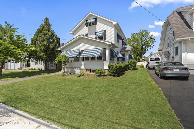 23 Stokes St, Freehold, NJ 07728 - view of front facade featuring a front yard