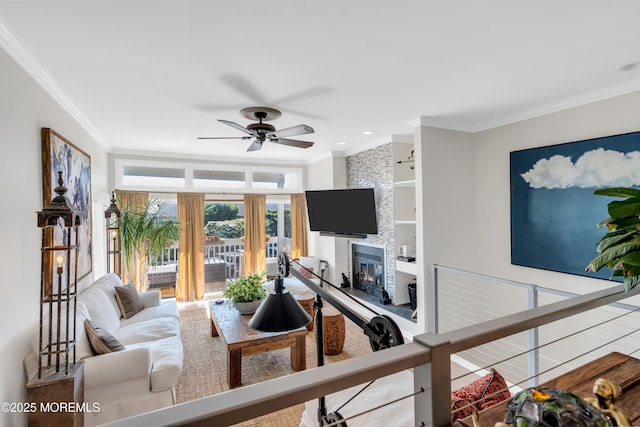 1 Portland Rd Unit 13, Highlands, NJ 07732 - living room featuring built in features, ornamental molding, a large fireplace, and a ceiling fan