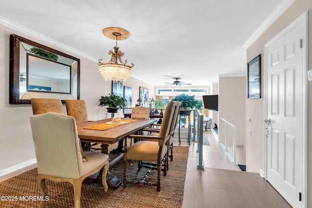 1 Portland Rd Unit 13, Highlands, NJ 07732 - dining space featuring crown molding, wood finished floors, a chandelier, baseboards, and ceiling fan
