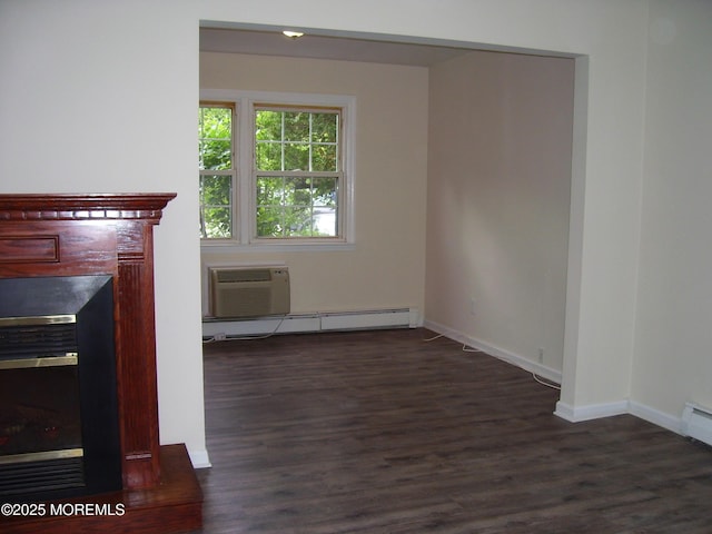 364 Westwood Ave Unit 12, Long Branch, NJ 07740 - unfurnished living room with baseboard heating, a wall mounted air conditioner, dark wood-style flooring, and baseboards