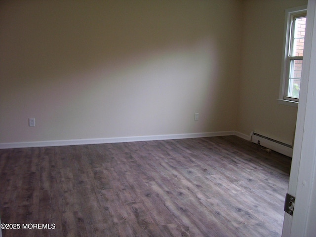 364 Westwood Ave Unit 12, Long Branch, NJ 07740 - spare room with a baseboard radiator, wood finished floors, and baseboards