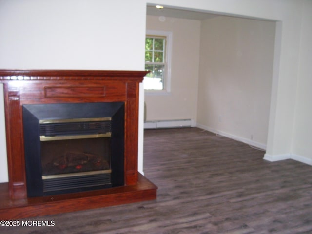 364 Westwood Ave Unit 12, Long Branch, NJ 07740 - detailed view of a baseboard radiator, a glass covered fireplace, wood finished floors, and baseboards