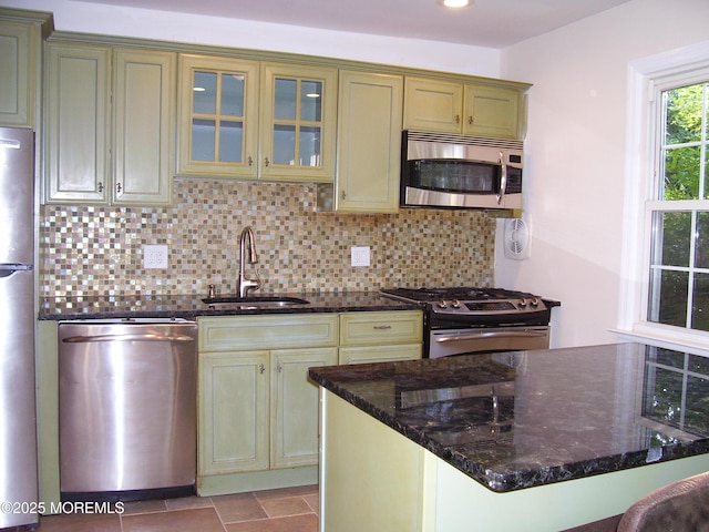 364 Westwood Ave Unit 12, Long Branch, NJ 07740 - kitchen with stainless steel appliances, a sink, tasteful backsplash, dark stone counters, and recessed lighting