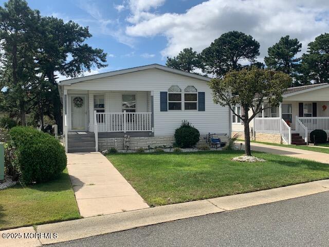 507 Momosa Way, Whiting, NJ 08759 - view of front of property featuring a porch and a front yard