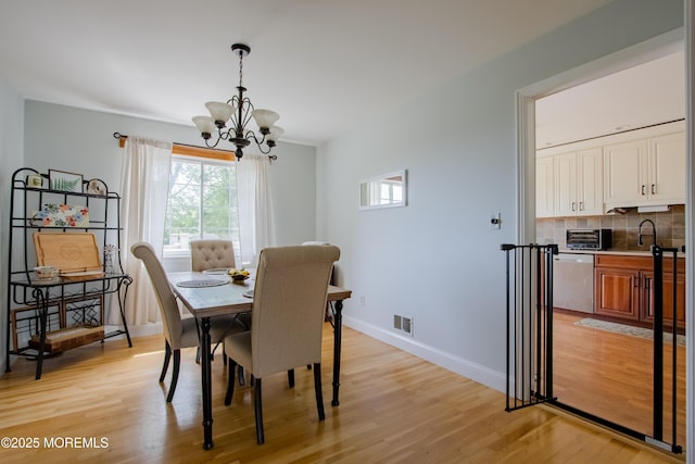 20 Koosman Dr, Leonardo, NJ 07737 - dining room with a chandelier, light wood-style floors, and baseboards