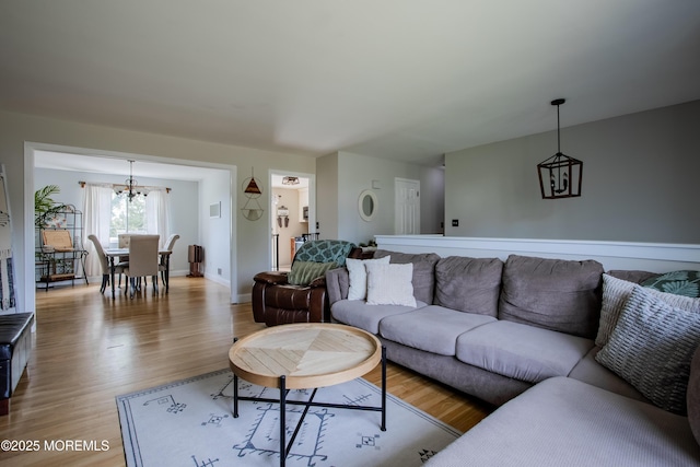 20 Koosman Dr, Leonardo, NJ 07737 - living area featuring a chandelier, wood finished floors, and baseboards