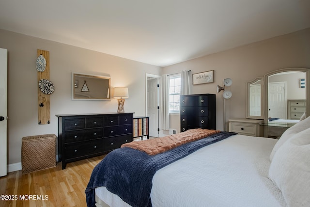 20 Koosman Dr, Leonardo, NJ 07737 - bedroom featuring wood finished floors, arched walkways, and baseboards